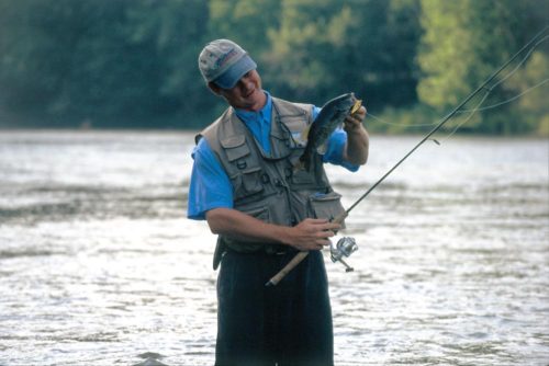 Angler holding a smallmouth bass